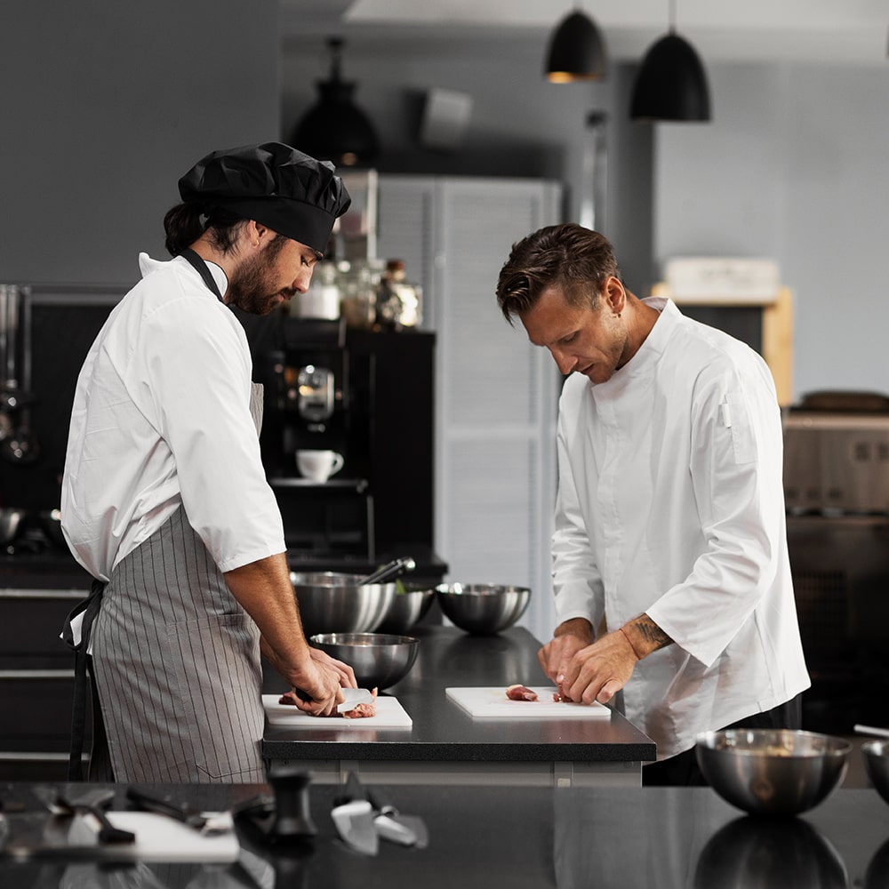 two chefs working at Original India takeaway in Larkhall 